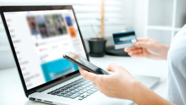 Shopping online icon , Online banking woman using Laptop ,smartphone holding credit card online shopping concept.