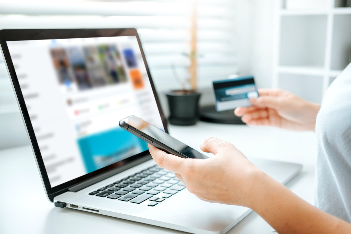 Shopping online icon , Online banking woman using Laptop ,smartphone holding credit card online shopping concept.